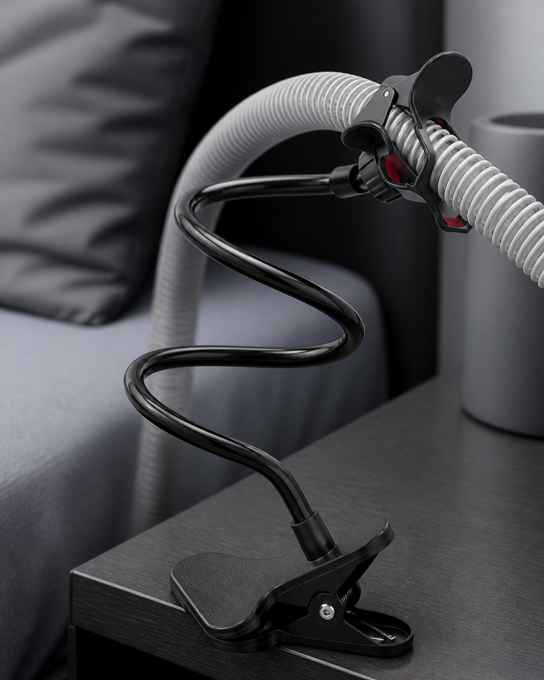 Close-up of the Drift spring clamp, glossy S-curved gooseneck and red-padded hose clip